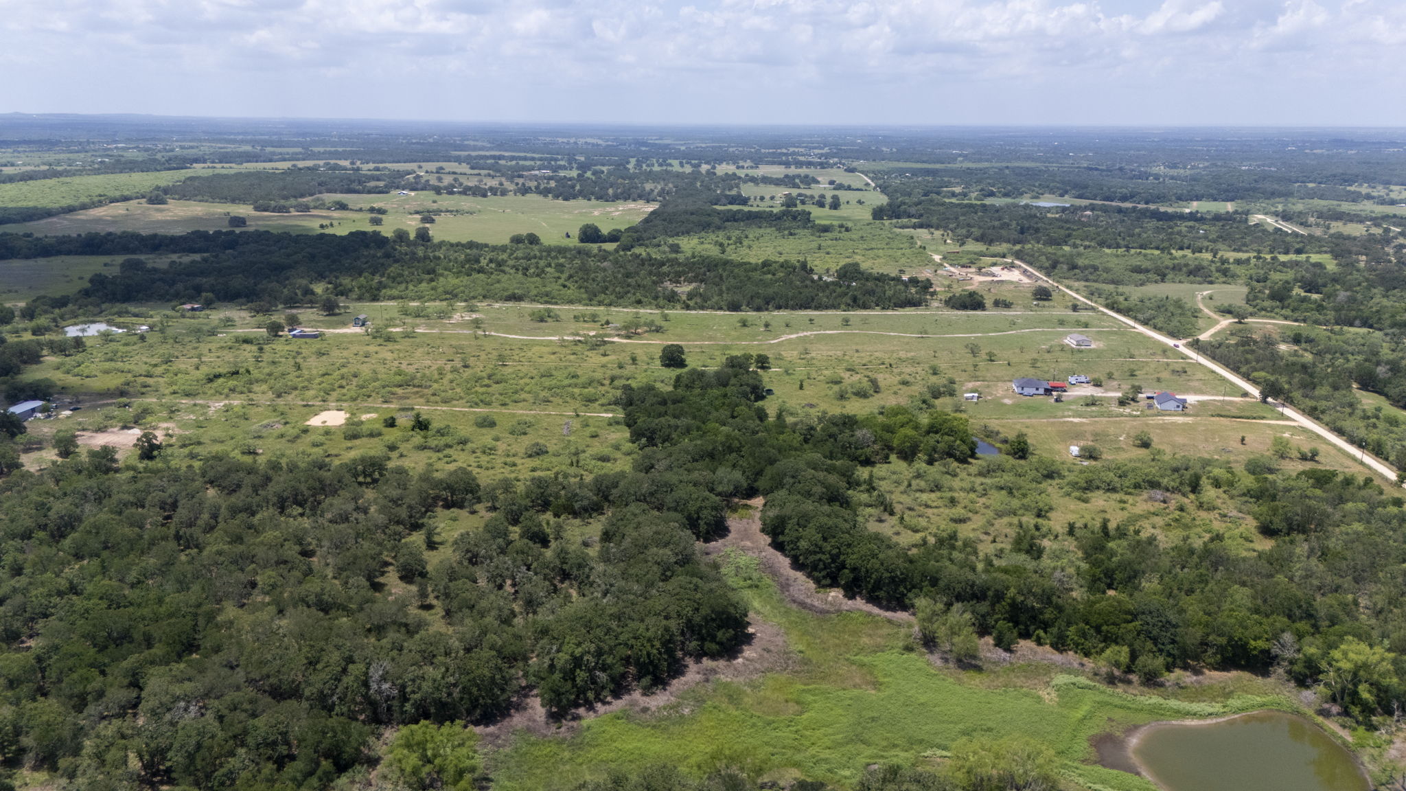 401 Turnback Trail Dale, TX 78616 - Photo 6 of 34 an aerial view of residential houses with outdoor space and trees