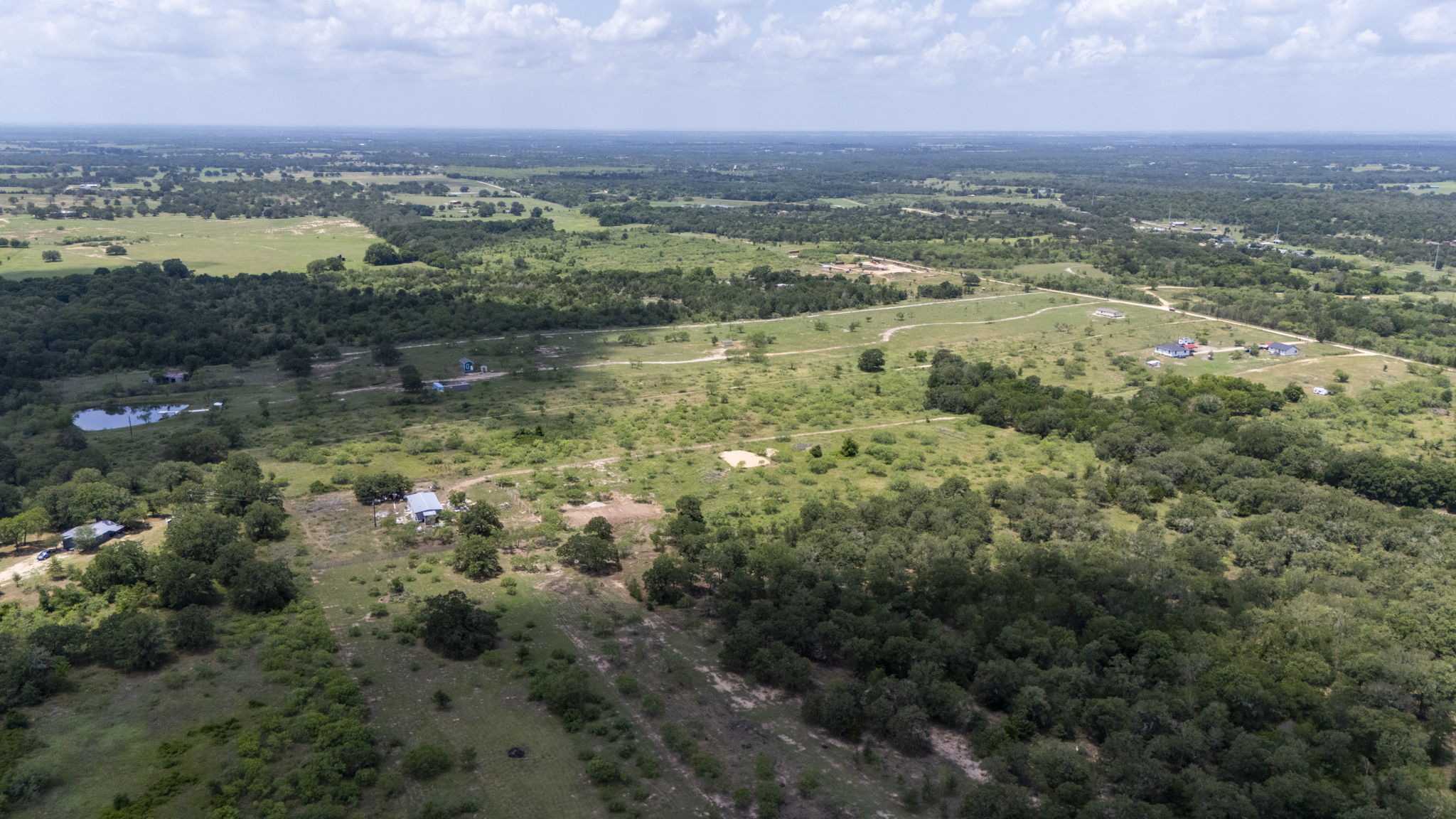 401 Turnback Trail Dale, TX 78616 - Photo 7 of 34 an aerial view of residential building and lake