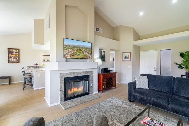 a living room with furniture and a fireplace