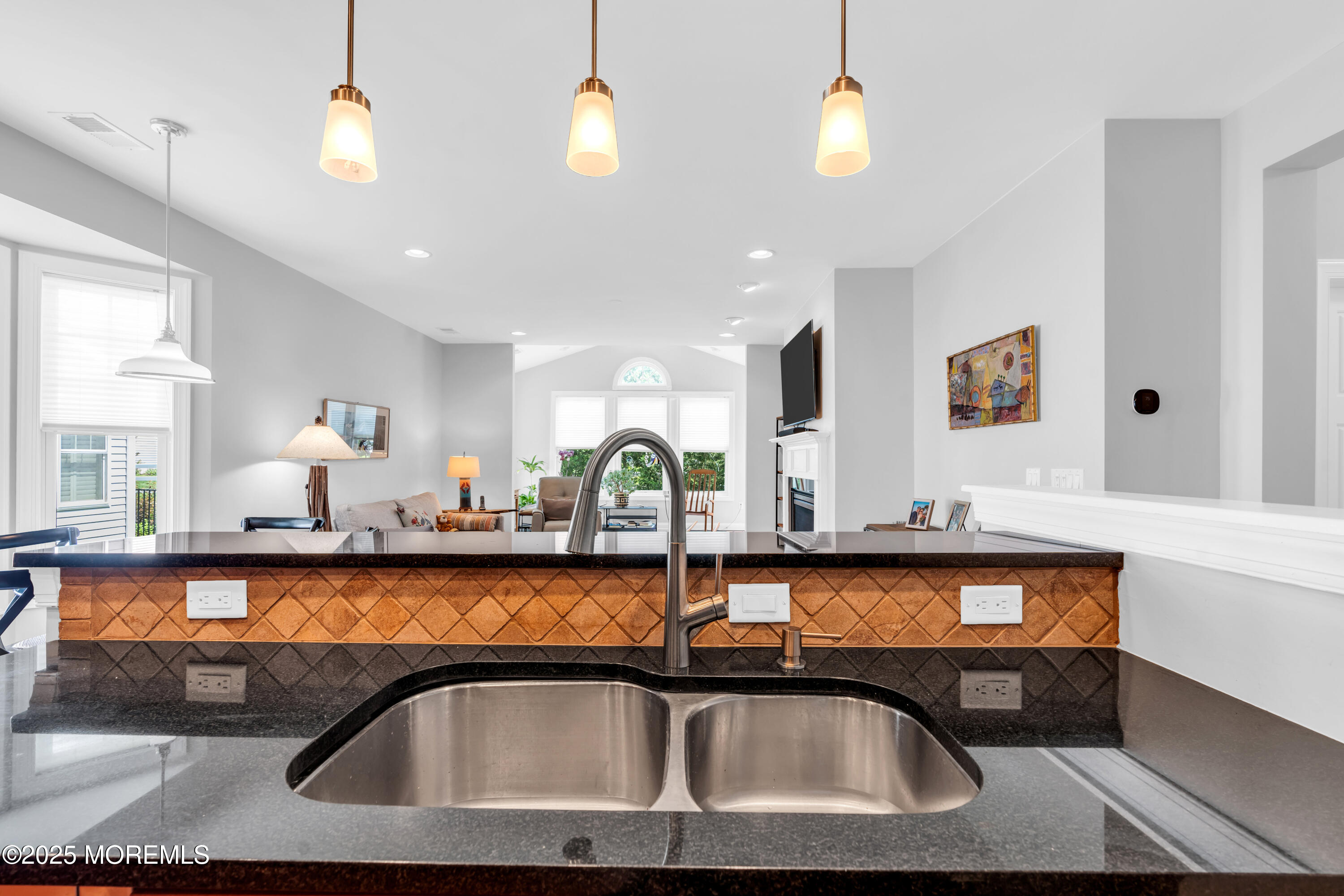 16 Haskell Way Oceanport, NJ 07757 - Photo 19 of 43 a bathroom with a sink a faucet a lamp and a mirror