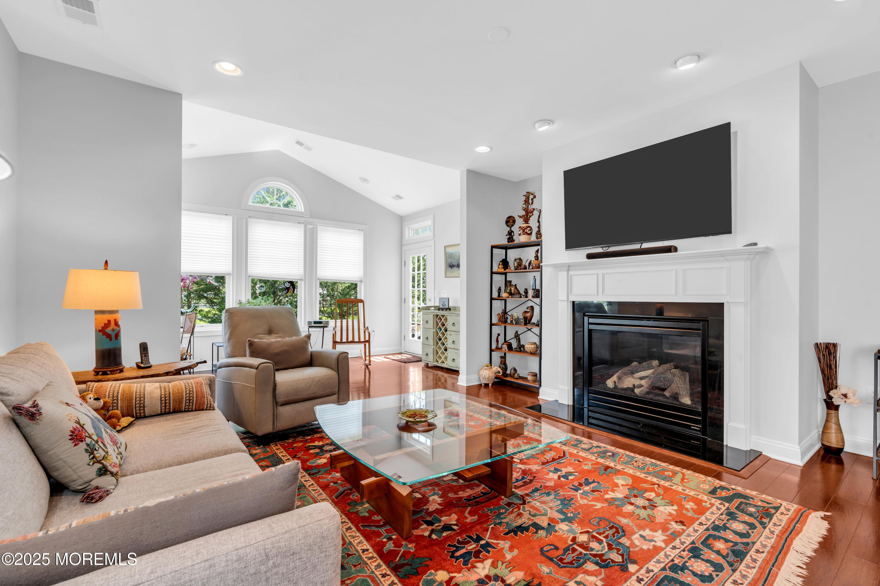 16 Haskell Way Oceanport, NJ 07757 - Photo 24 of 43 a living room with furniture a flat screen tv and a fireplace