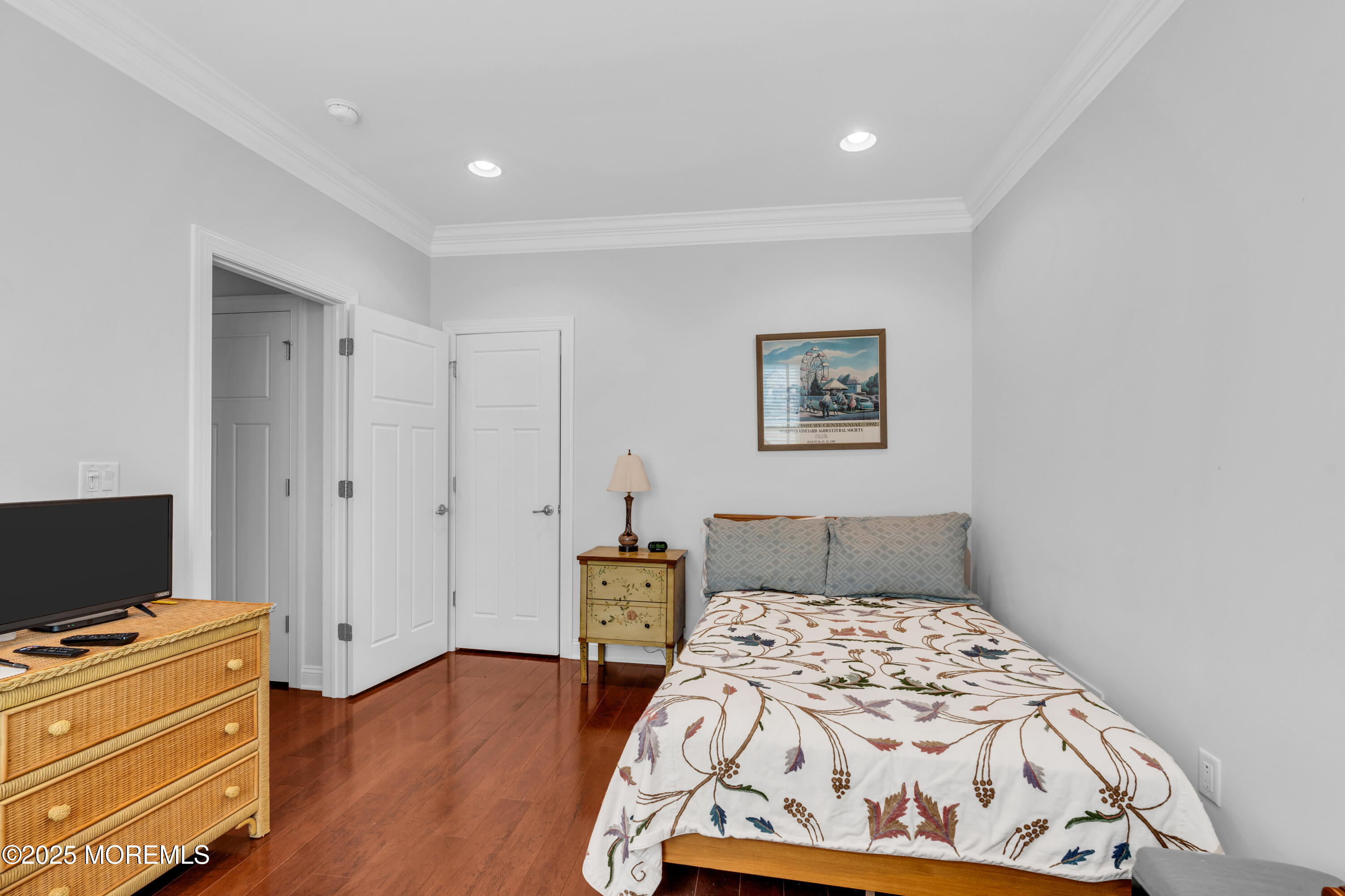 16 Haskell Way Oceanport, NJ 07757 - Photo 28 of 43 a bedroom with a bed and a flat screen tv
