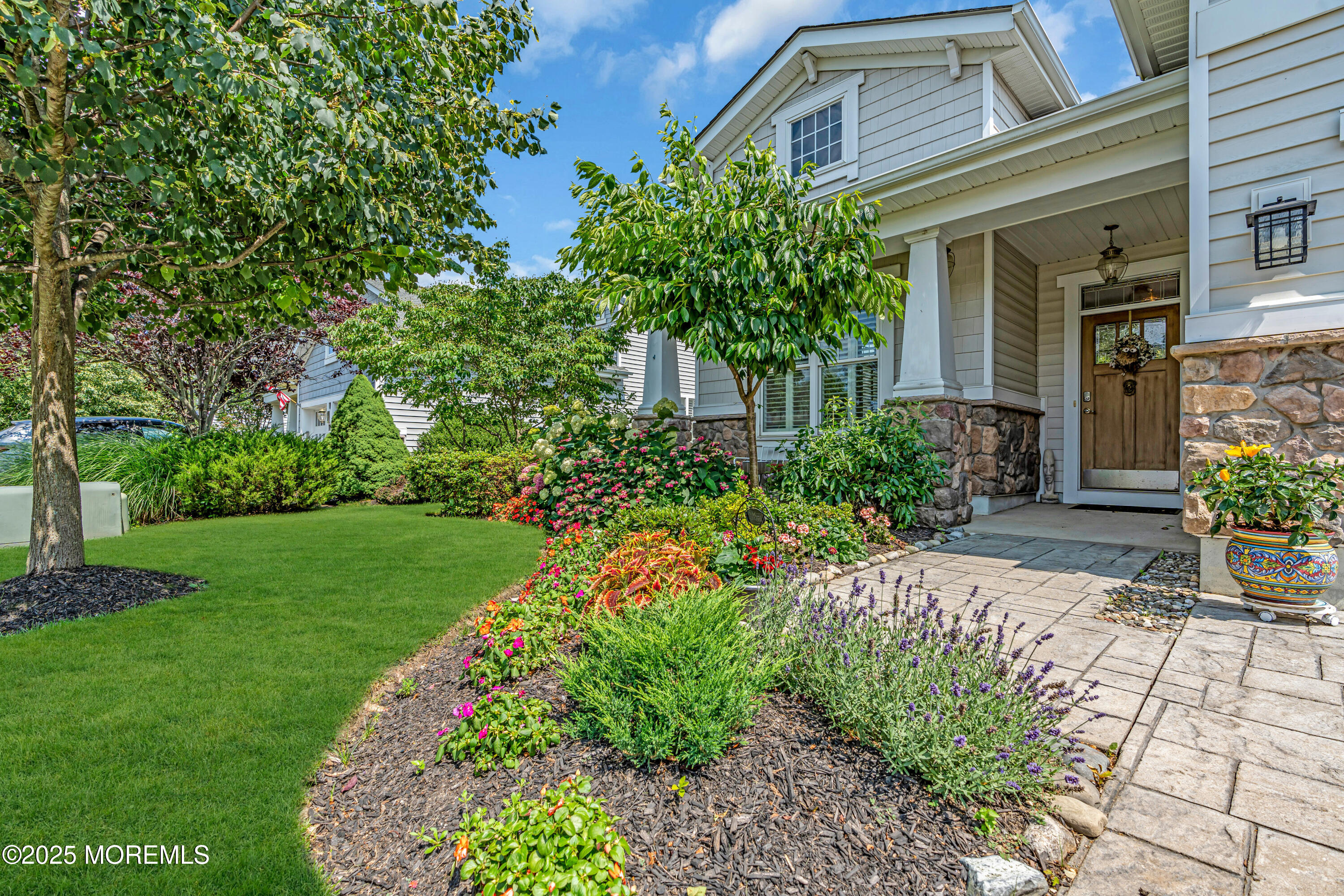 16 Haskell Way Oceanport, NJ 07757 - Photo 3 of 43 a front view of a house with garden