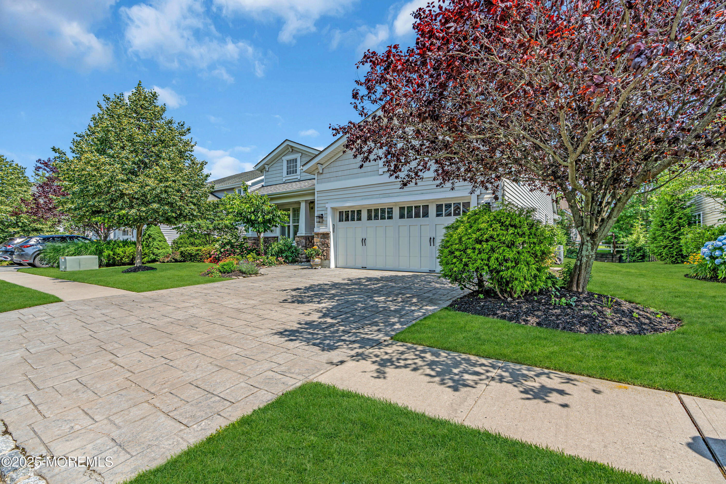 16 Haskell Way Oceanport, NJ 07757 - Photo 5 of 43 a front view of a house with a garden