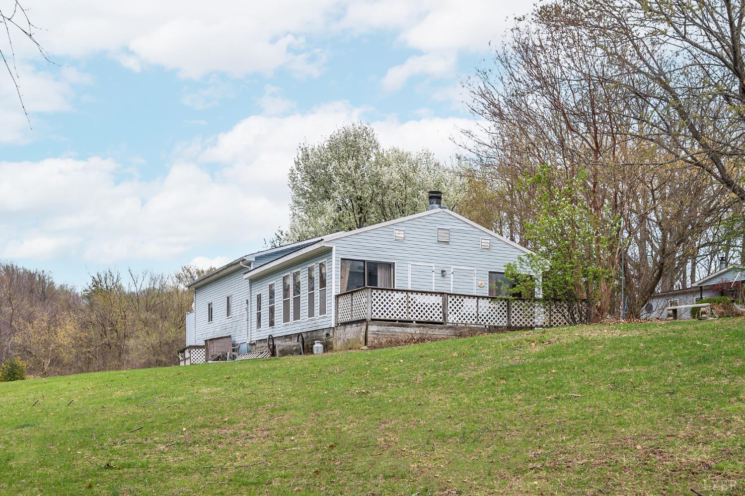 4400 Murray Hollow Road Thaxton, VA 24174 - Photo 25 of 56 a view of a house with a yard