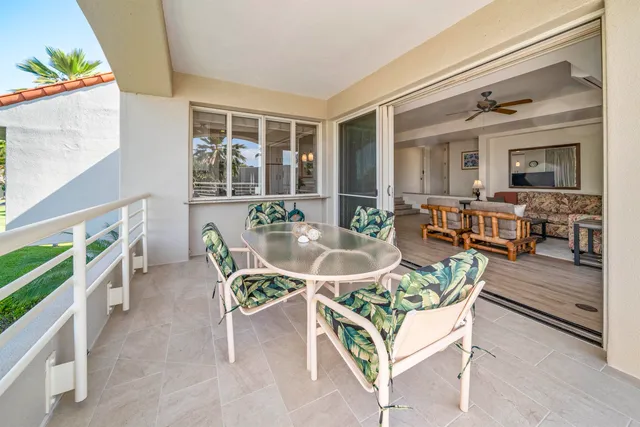 a bathroom with a double vanity sink toilet mirror and bathtub