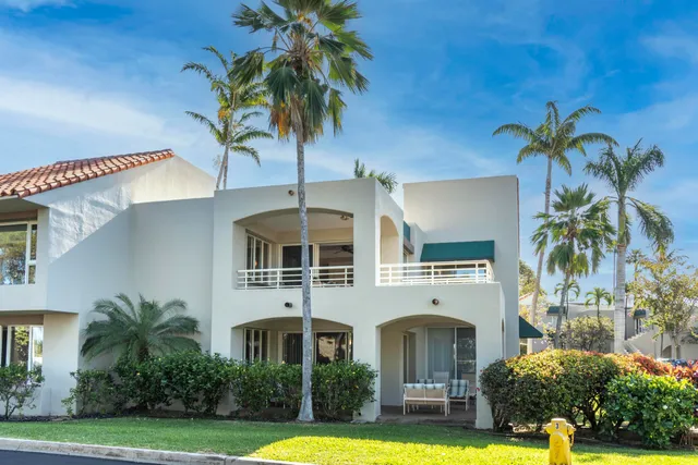 a view of a backyard with sitting area