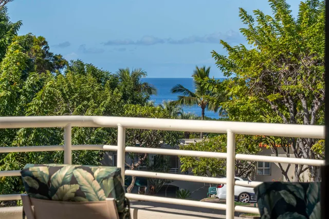 a view of a balcony with furniture