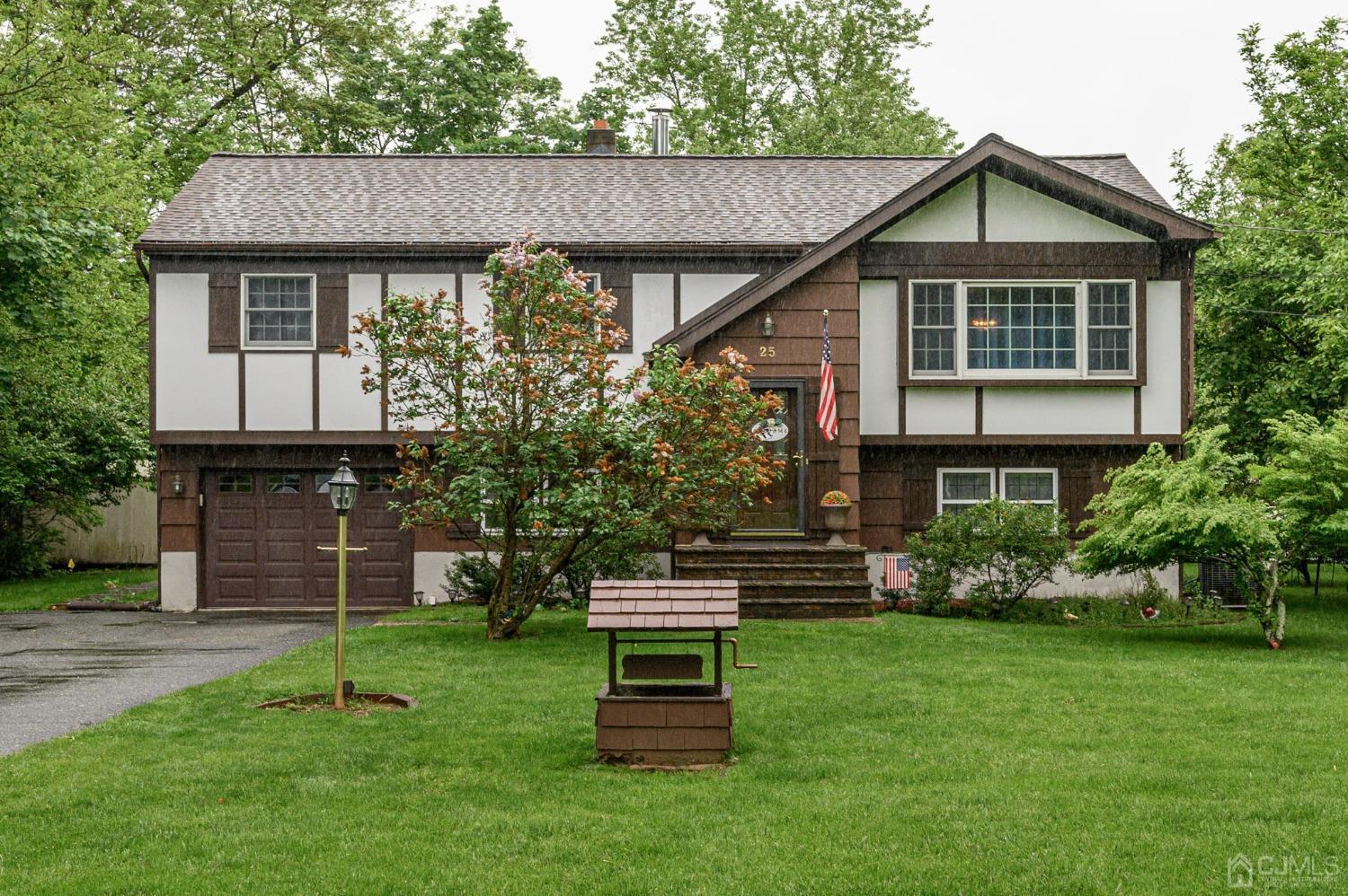 25 Sunset Drive Andover, NJ 07821 - Photo 1 of 43 a front view of a house with a garden