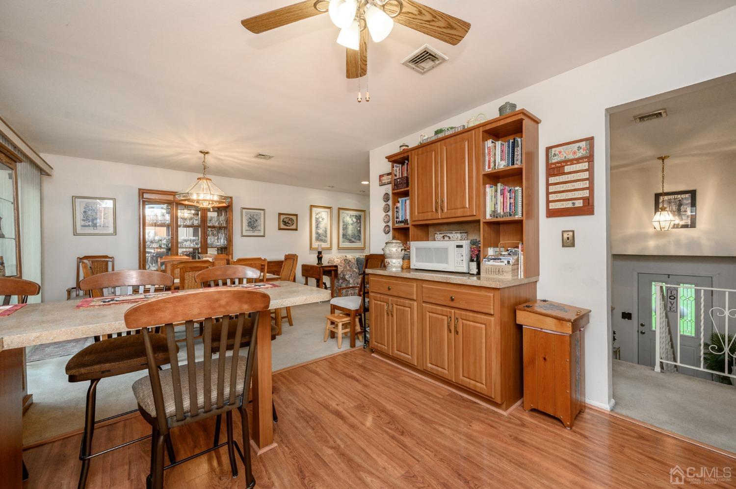 25 Sunset Drive Andover, NJ 07821 - Photo 12 of 43 a large kitchen with a table and chairs