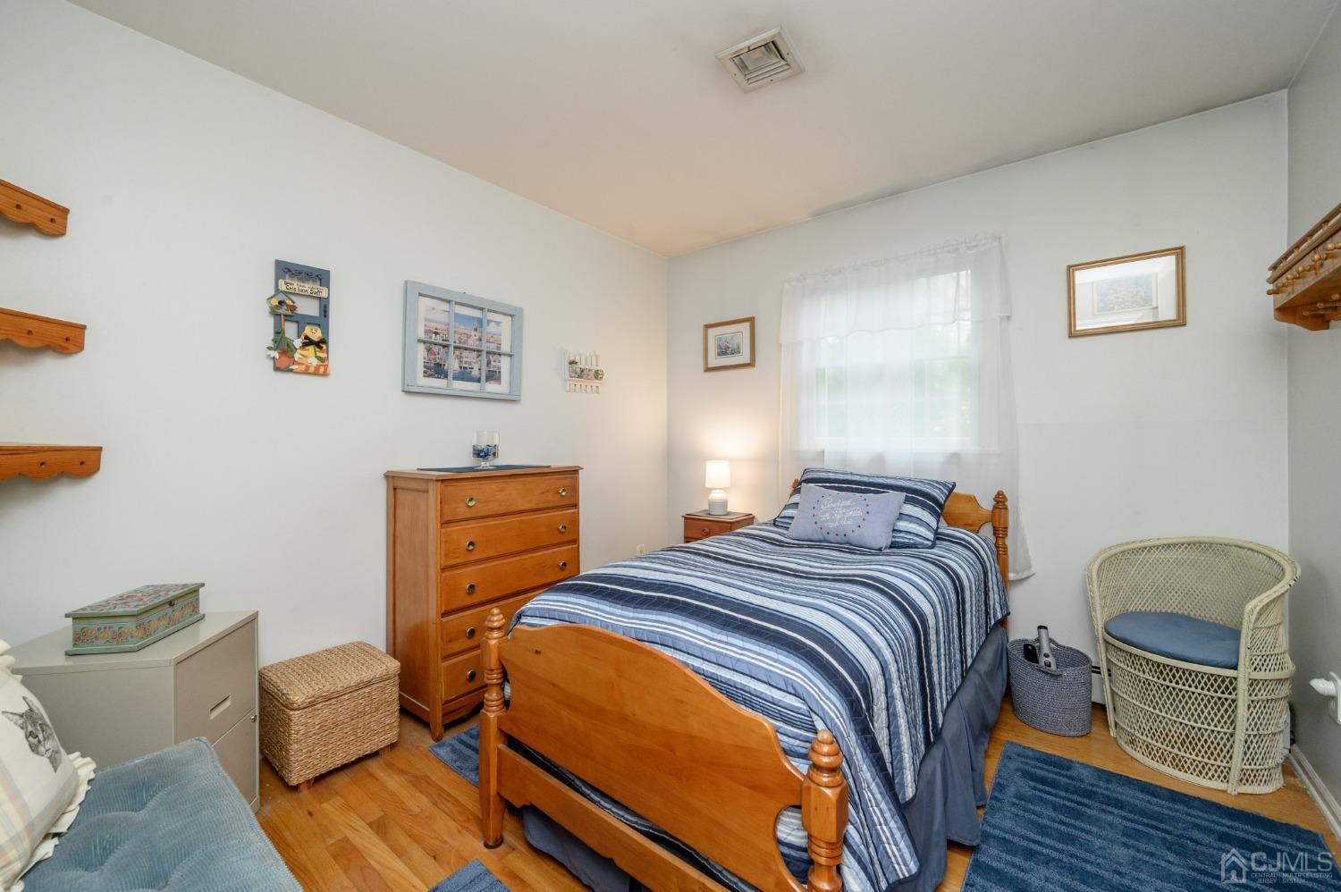 25 Sunset Drive Andover, NJ 07821 - Photo 14 of 43 a bed room with a bed and a chair