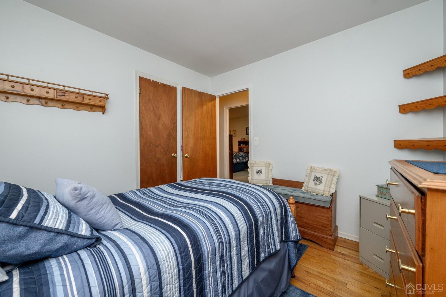 25 Sunset Drive Andover, NJ 07821 - Photo 15 of 43 a bedroom with a bed and wooden floor