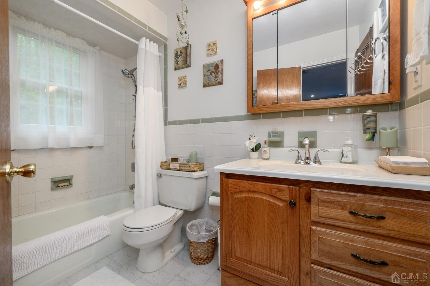 25 Sunset Drive Andover, NJ 07821 - Photo 18 of 43 a bathroom with a sink a toilet and bathtub