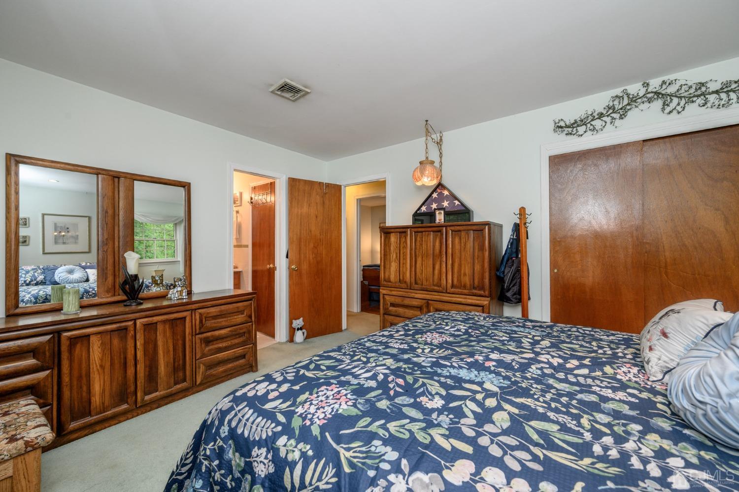 25 Sunset Drive Andover, NJ 07821 - Photo 20 of 43 a bedroom with a bed and wooden floor