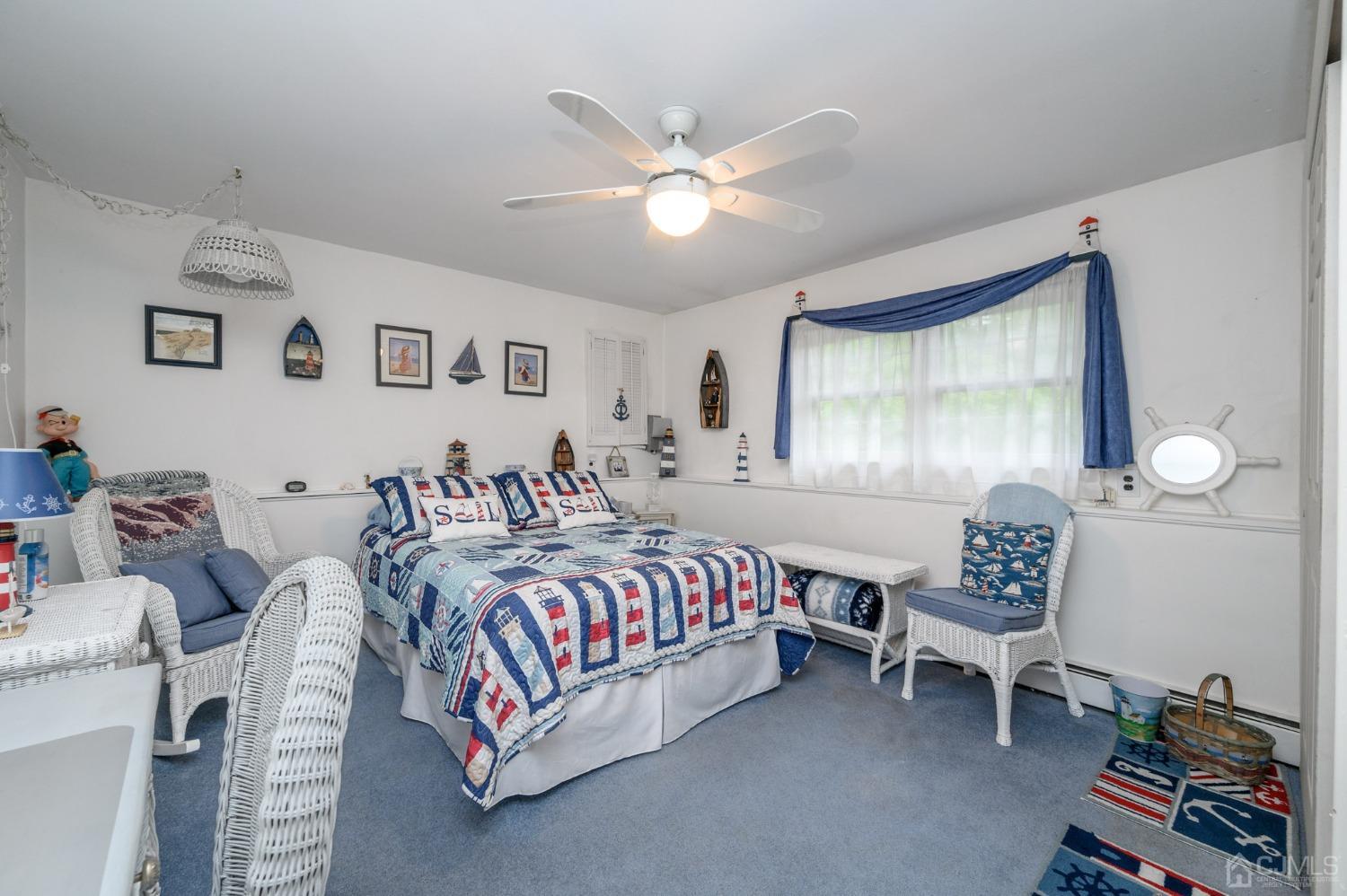 25 Sunset Drive Andover, NJ 07821 - Photo 22 of 43 a bedroom with a bed and a window