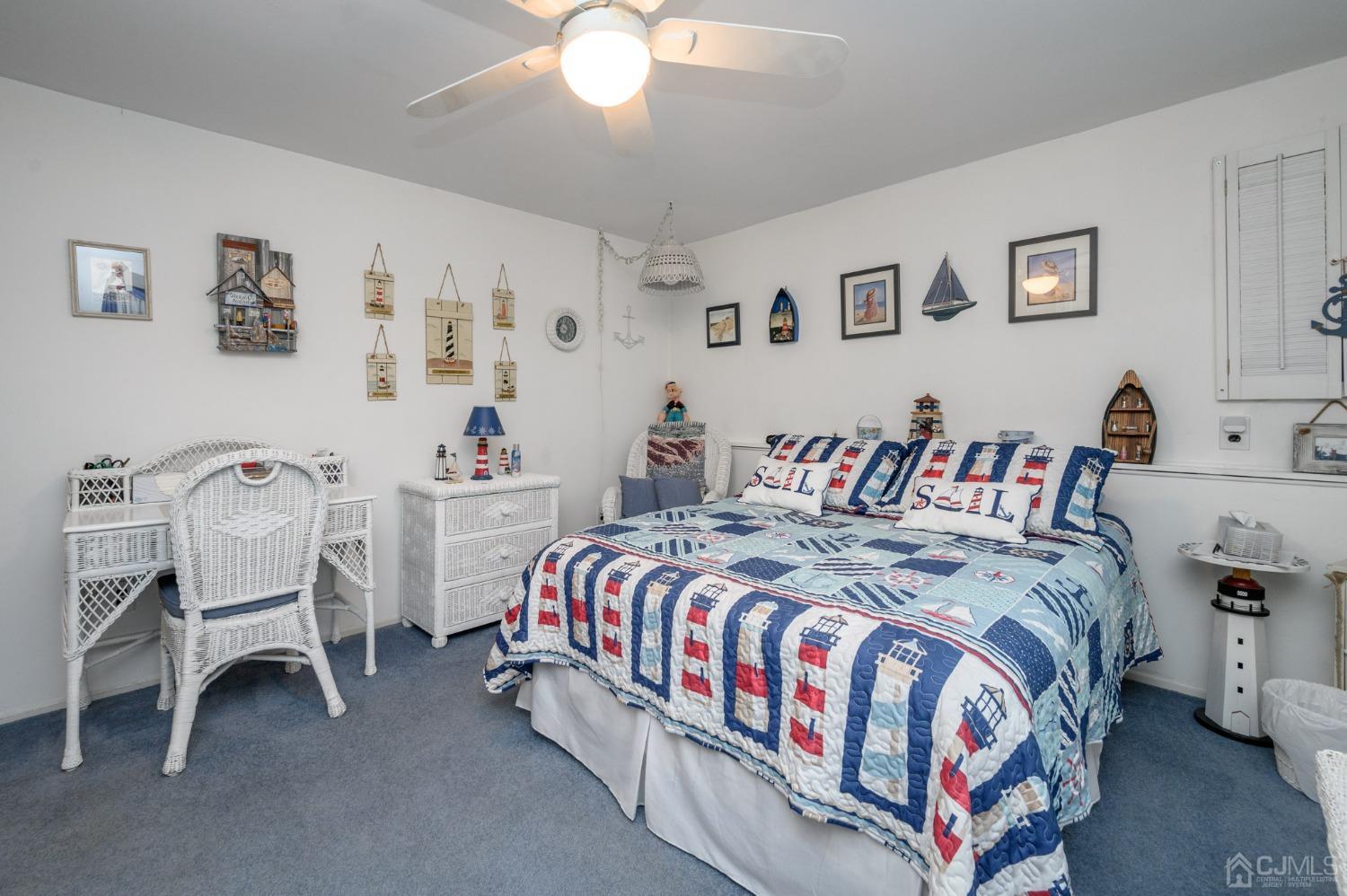 25 Sunset Drive Andover, NJ 07821 - Photo 23 of 43 a bedroom with a bed and a table