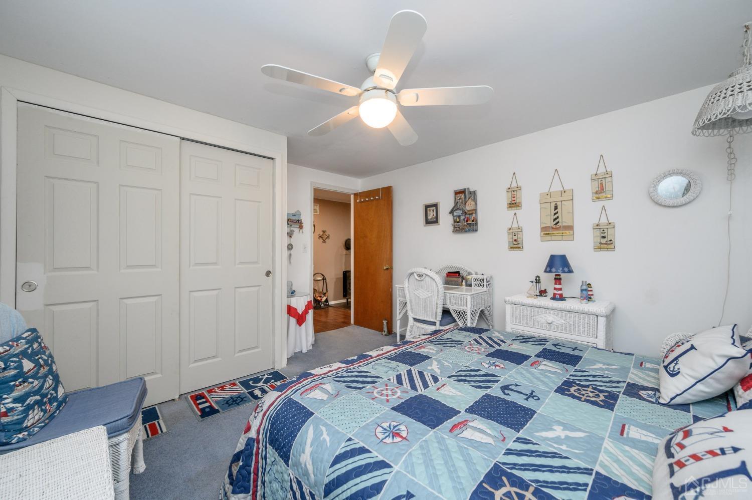 25 Sunset Drive Andover, NJ 07821 - Photo 24 of 43 a bed room with a bed and a chandelier