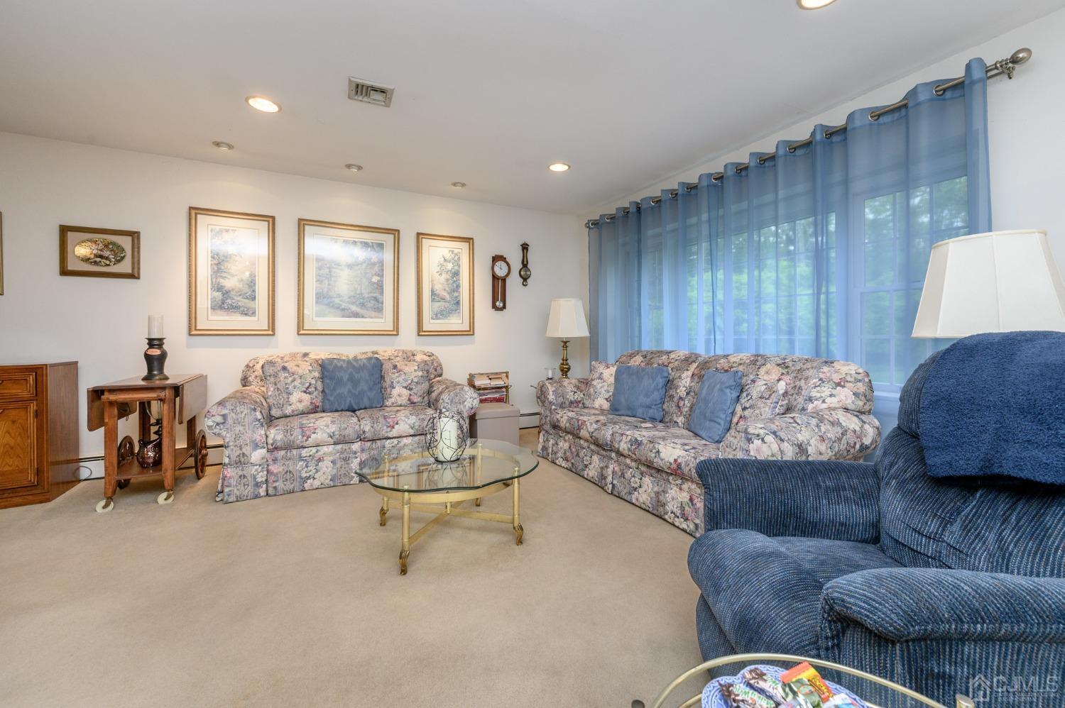 25 Sunset Drive Andover, NJ 07821 - Photo 3 of 43 a living room with furniture and a couch