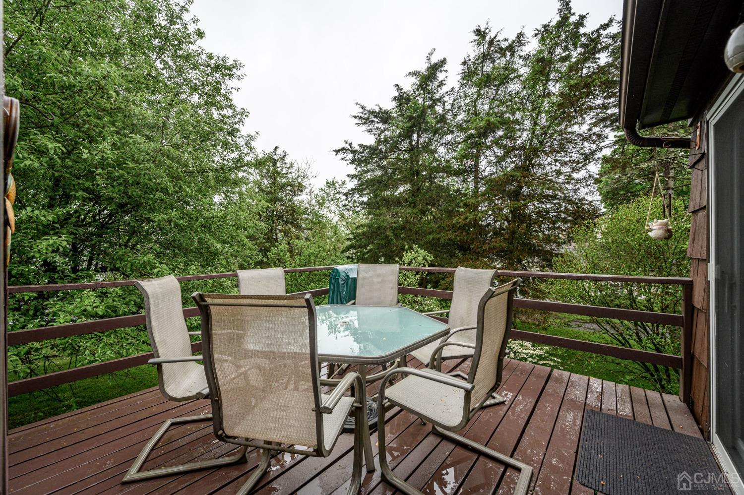 25 Sunset Drive Andover, NJ 07821 - Photo 33 of 43 a balcony with table and chairs