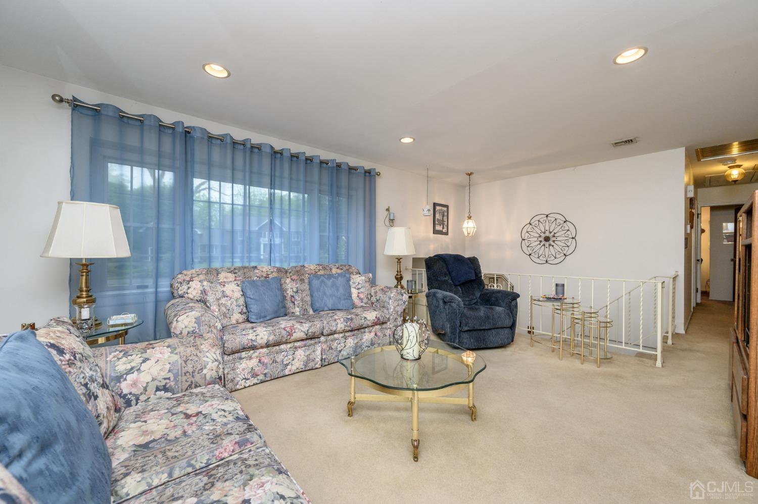 25 Sunset Drive Andover, NJ 07821 - Photo 5 of 43 a living room with furniture and a table