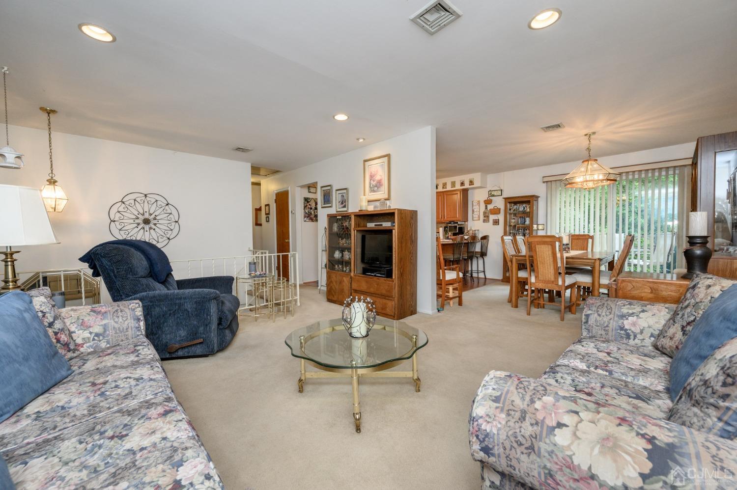 25 Sunset Drive Andover, NJ 07821 - Photo 6 of 43 a living room with furniture and wooden floor
