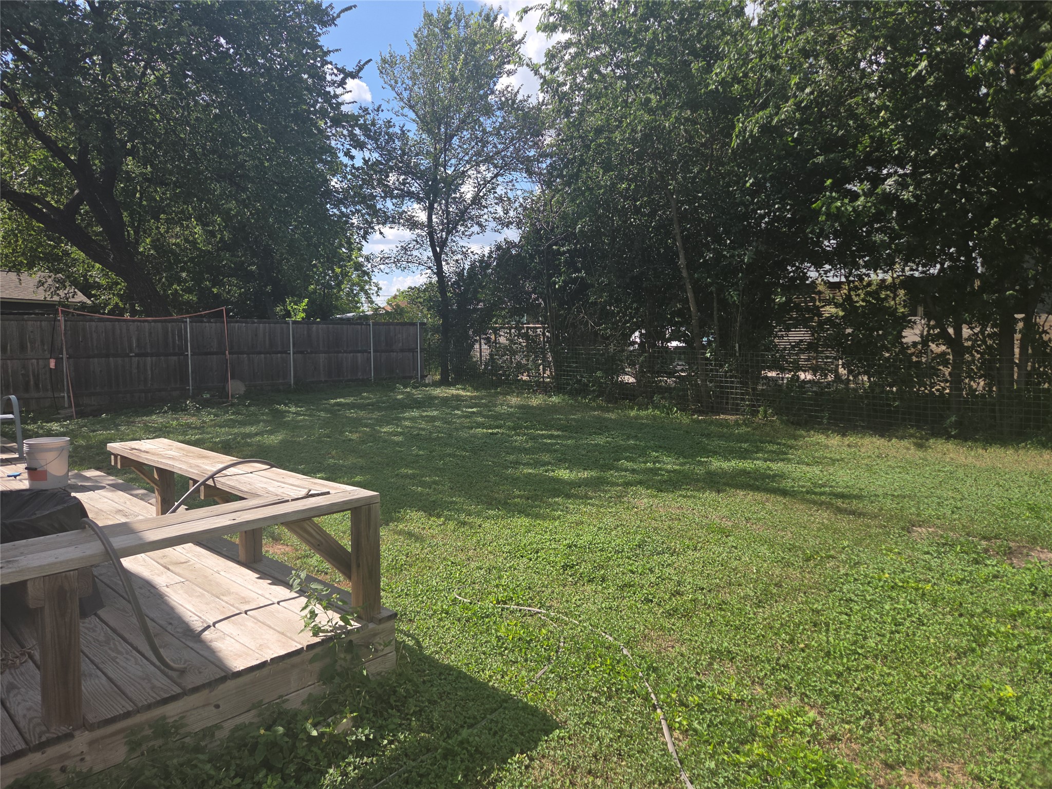 922 East 50th Street Austin, TX 78751 - Photo 33 of 35 A spacious, verdant yard with mature trees offers a private outdoor retreat.
