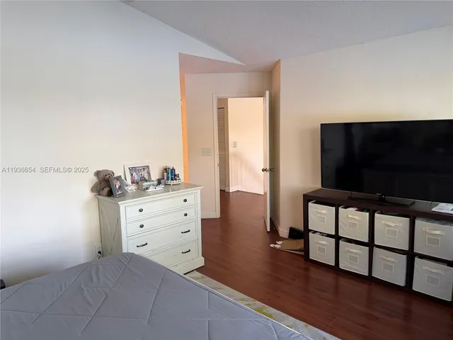 a bedroom with furniture and a window