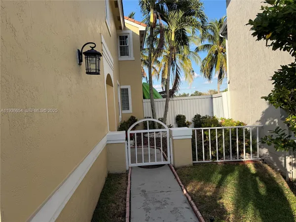 a view of a balcony with next to a yard