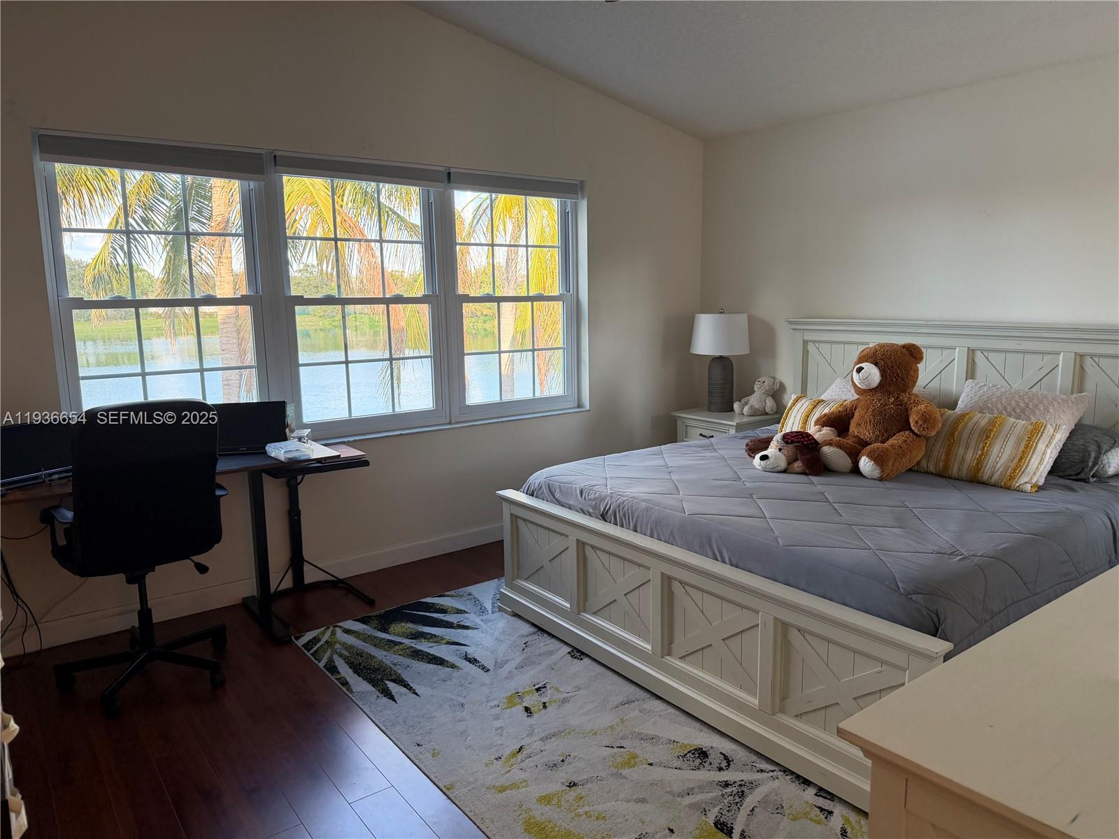 4908 Southwest 151st Avenue, Unit 1 Davie, FL 33331 - Photo 10 of 28 a bedroom with a bed and a window