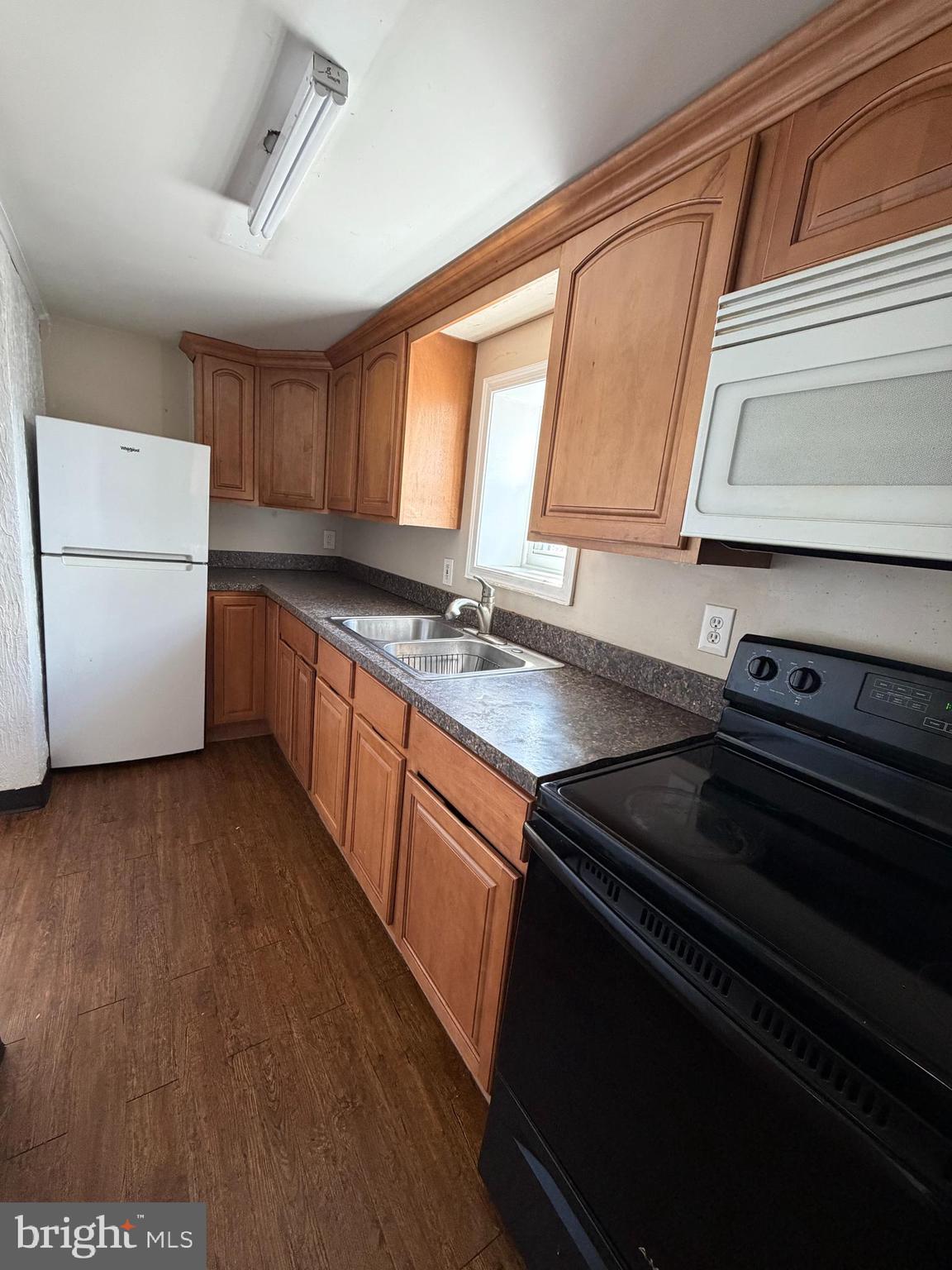 230 North 3rd Street Columbia, PA 17512 - Photo 6 of 15 a kitchen with a sink stove and cabinets