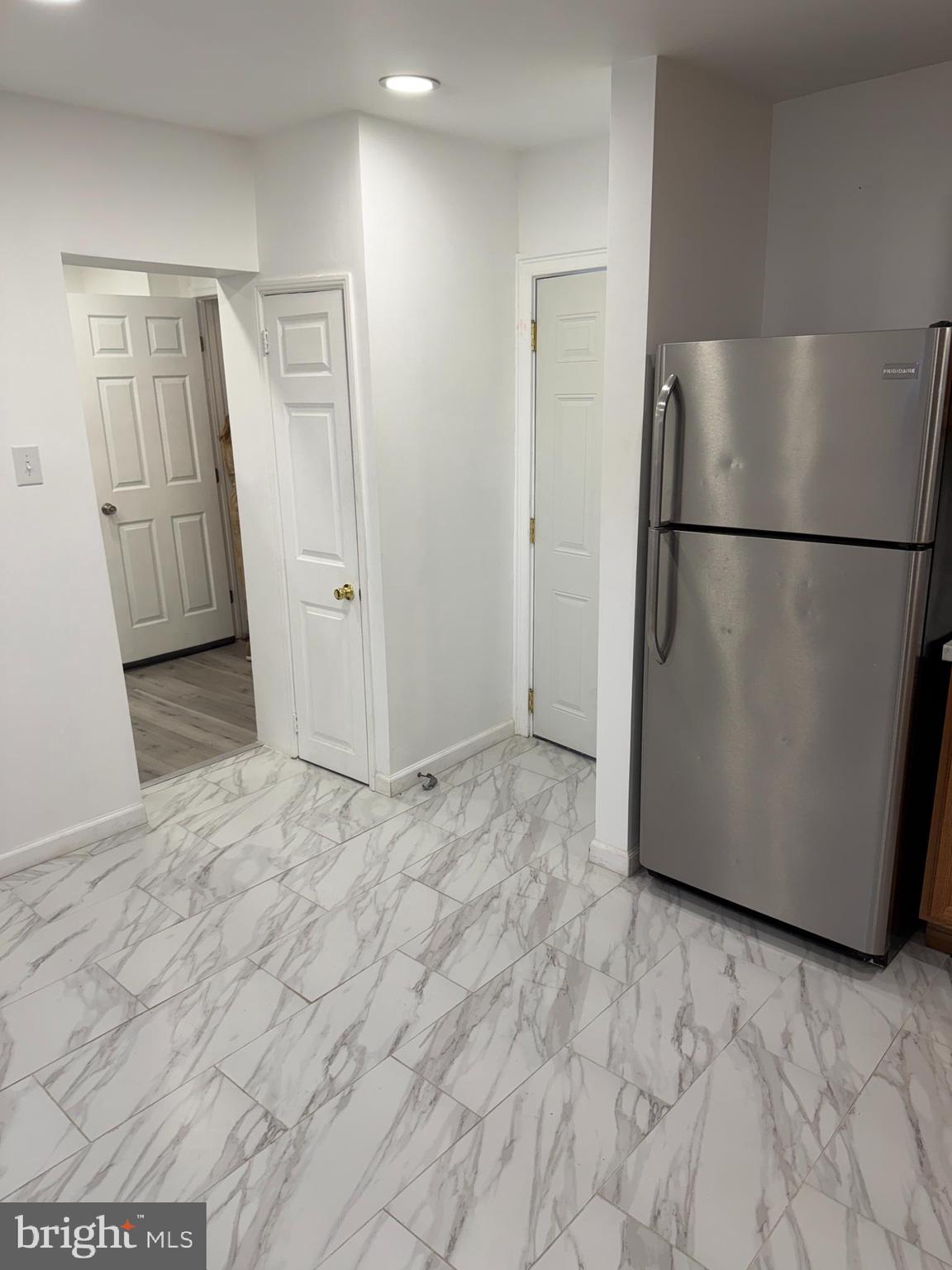 230 North 3rd Street Columbia, PA 17512 - Photo 8 of 15 a view of empty room with wooden floor and refrigerator