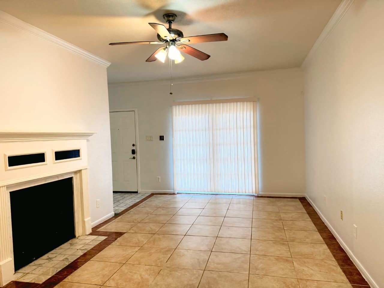 2121 El Paseo Street, Unit 1801 Houston, TX 77054 - Photo 7 of 12 a view of a livingroom with a chandelier fan and a fireplace
