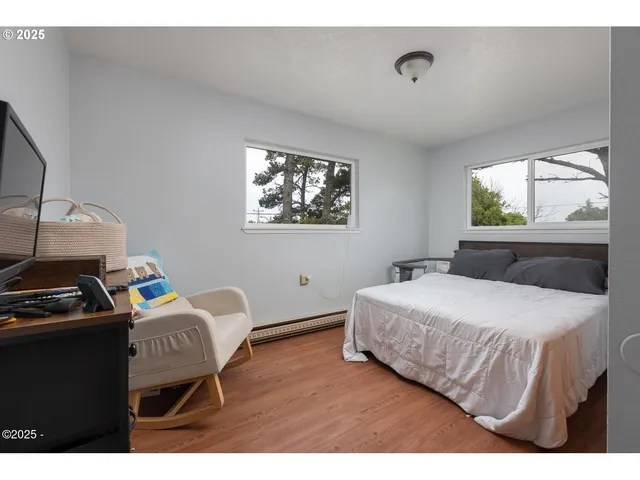 a bedroom with bed and a window