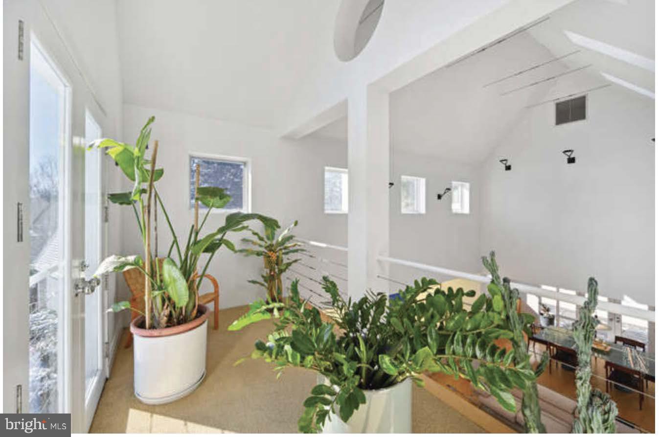 4527 Q Place Northwest Washington, DC 20007 - Photo 11 of 54 a white vase with flowers on the table