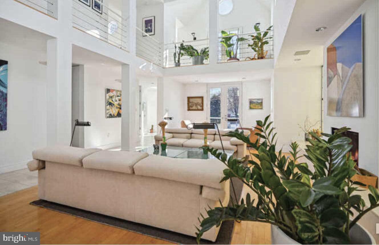 4527 Q Place Northwest Washington, DC 20007 - Photo 13 of 54 a living room with furniture and a chandelier