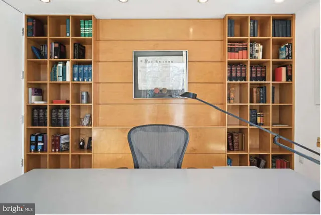 a dining table with chairs and window