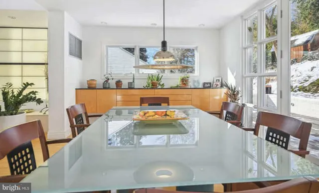 a bathroom with a granite countertop toilet sink and mirror