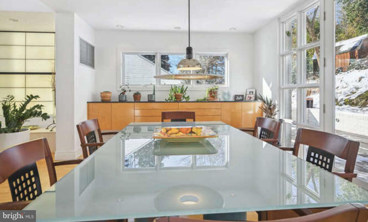 4527 Q Place Northwest Washington, DC 20007 - Photo 22 of 54 a dining table with chairs and window