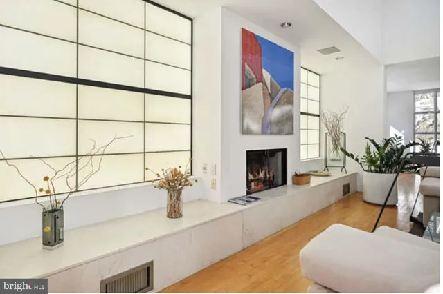 a view of hallway with furniture and a window
