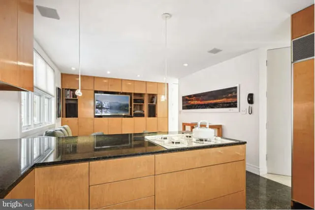 a living room with furniture and a painting