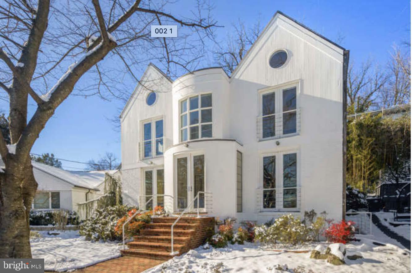4527 Q Place Northwest Washington, DC 20007 - Photo 4 of 54 a front view of a house with a yard