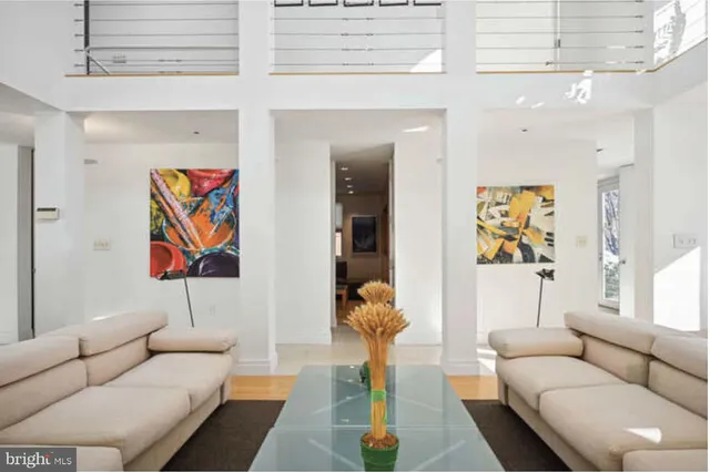 a bathroom with double vanity and a mirror