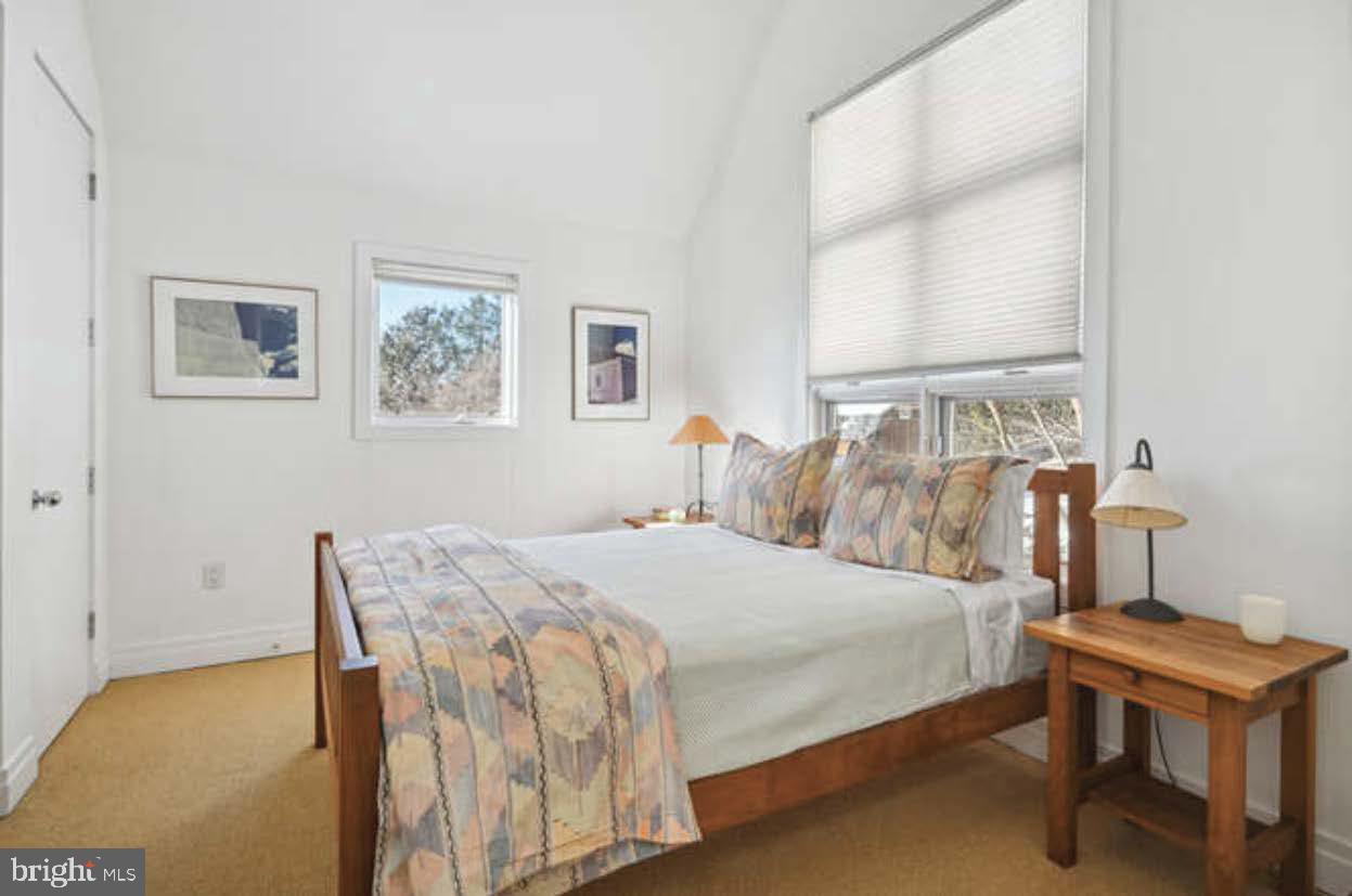 4527 Q Place Northwest Washington, DC 20007 - Photo 47 of 54 a bedroom with a bed and a table in it