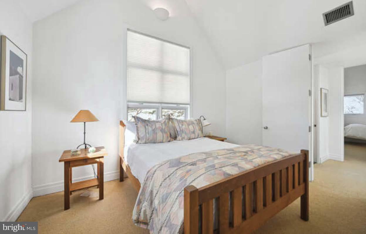 4527 Q Place Northwest Washington, DC 20007 - Photo 51 of 54 a bedroom that has a bed and a table in it