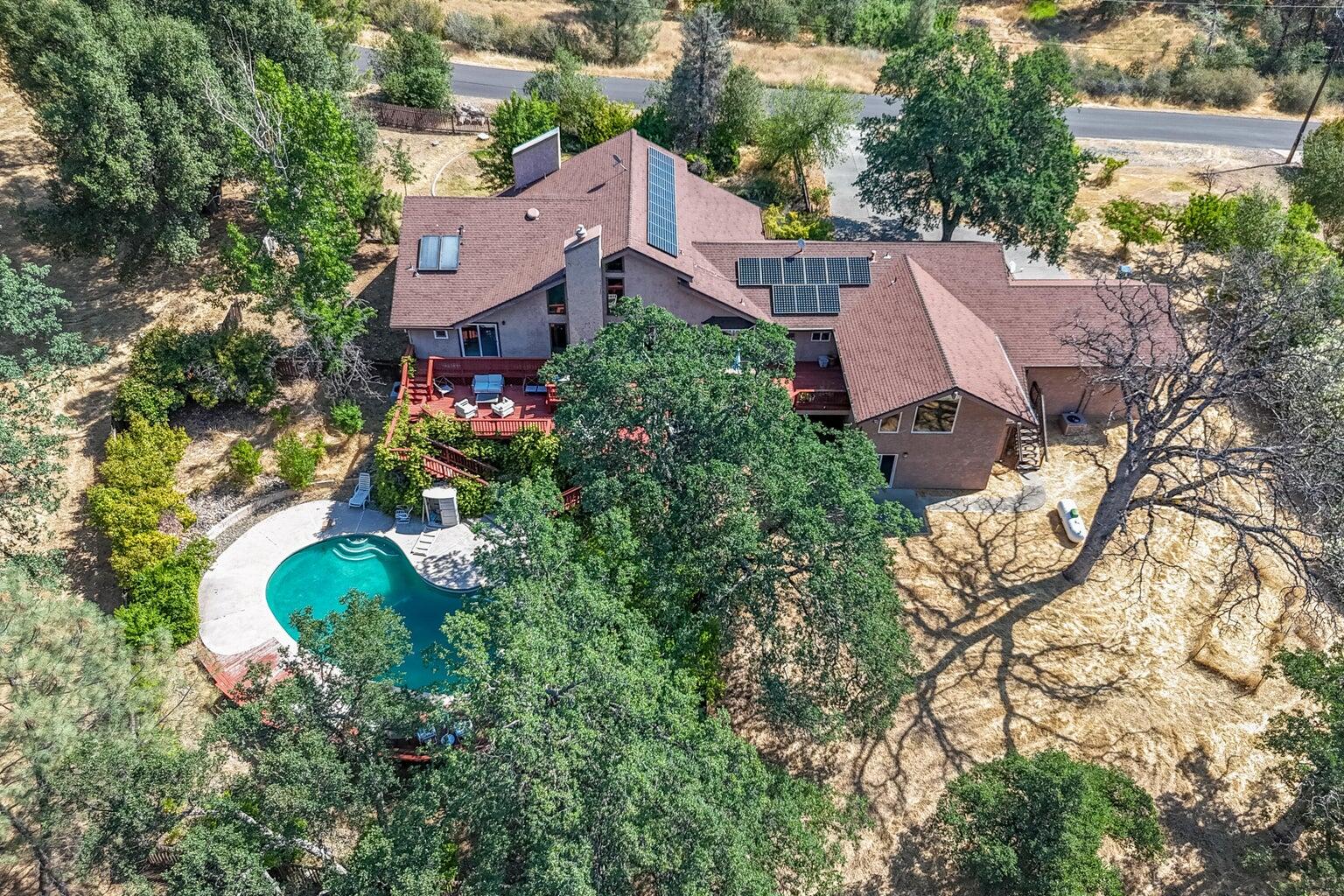 8846 Goldstone Lane Redding, CA 96001 - Photo 1 of 64 an aerial view of a house with a yard and street