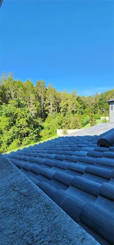 a bathroom with a sink a large mirror and a bathtub