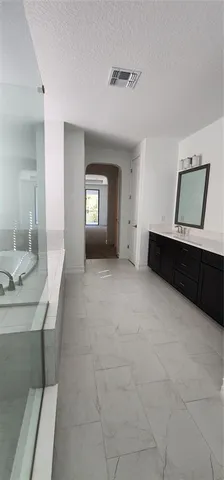 a bathroom with a toilet a sink and bathtub