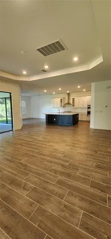 a view of a room with kitchen island