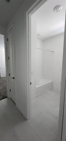 a bathroom with a shower and toilet