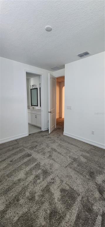 29868 Picana Lane Wesley Chapel, FL 33543 - Photo 35 of 75 a view of an empty room